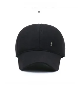 Detailed front view of black winter baseball cap featuring silver Fashion metal badge