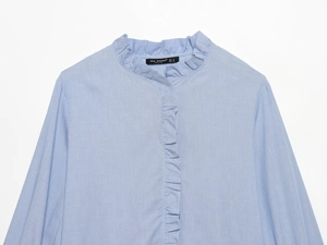 Detail of blue striped shirt showing ruffled stand collar and fine poplin texture
