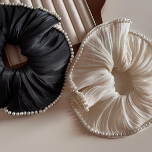 Lustrous satin hair scrunchies in black and white with elegant pearl edge decoration