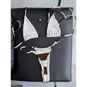 Brown and white striped two-piece bikini set with halter top and high-cut thong bottom