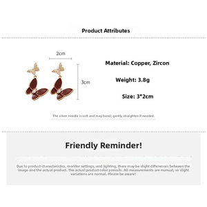 Detailed view of red butterfly earrings with zircon stones and 3x2cm size specifications