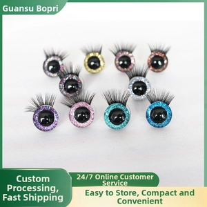 Close-up of colorful 3D doll eyes with glitter iris and long black eyelashes for DIY toys