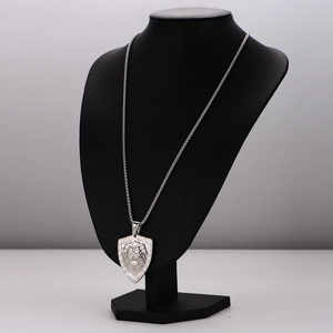 Mens hiphop stainless steel necklace featuring a lion head shield pendant on black bust