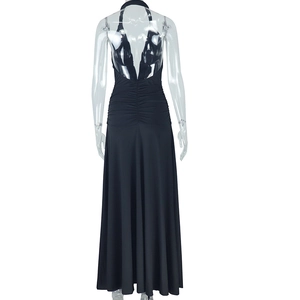 Detailed back view of a sexy black halter neck dress with ruched details and open back