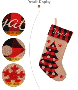 Detail display of Wyatt name embroidery and red plaid snowflake applique on burlap stocking