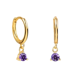 Detail view of gold hoop earrings featuring faceted round purple zircon gemstones