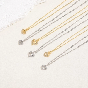 Elegant gold and silver heart necklaces with star pendants and zircon on white stone
