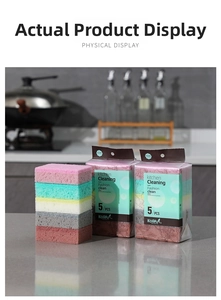 Detail shot of multi-color high-density kitchen cleaning sponges on a grey marble countertop
