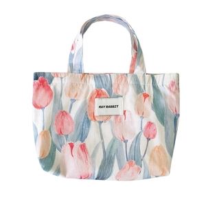 Cute tulip canvas handbag with floral patterns and May Rabbit label on white background