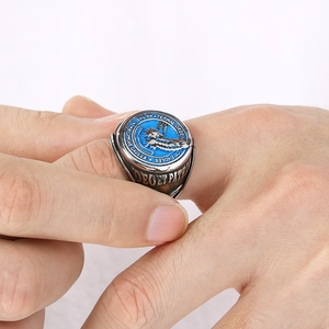 Macro shot of silver and blue enamel eagle signet ring with fraternal order engraving