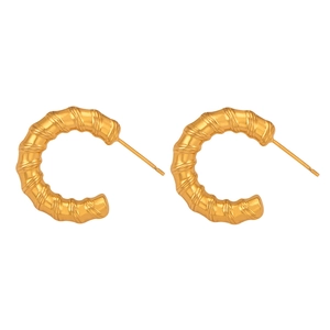 Elegant gold-plated C-shaped earrings with spiral twisted bamboo texture on white background