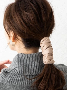 Japanese style khaki fabric hair wire wrap shown styling a low ponytail on model