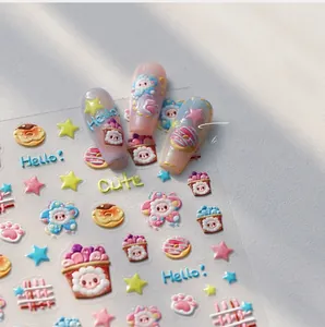 Close-up of 3D embossed nail stickers featuring rainbow donuts and sheep designs
