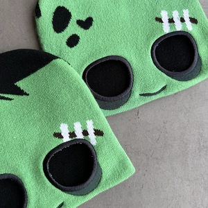 Green knit Frankenstein balaclava mask with black hair and stitched embroidery details