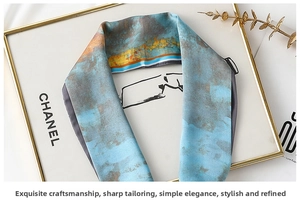Close-up of a blue and rust floral skinny scarf draped over a gold frame