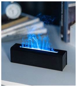 Detail view of the cool blue LED simulated flame effect on a sleek black humidifier