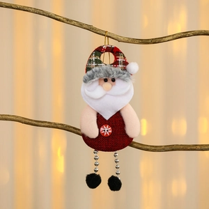 Charming Santa Claus fabric ornament with bead chain legs hanging on a Christmas tree branch