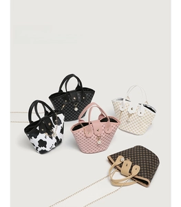 Multiple fashion bucket bags in various prints with pearl pendants and chain straps