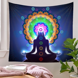 Detail of meditation tapestry with 7 chakra symbols and mandala in a home setting