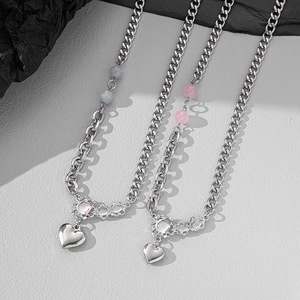 Minimalist silver chain necklace featuring heart pendants and colorful beads for women