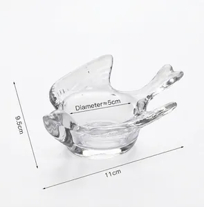 Detailed view of the clear glass bird candle holder with dimensions 9.5cm by 11cm