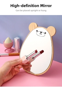 Detail of wooden bear makeup mirror with clear reflection and desktop standing function