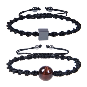 Detail of adjustable woven bracelet featuring white turquoise and square magnetic stones