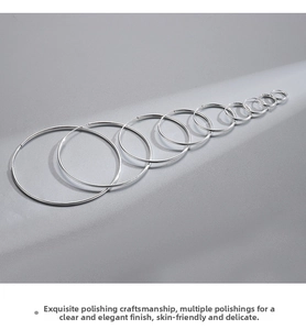 Polished S925 sterling silver hoop earrings in different sizes on grey matte surface