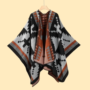 Detailed knit texture of colorful geometric pattern women shawl on wooden hanger