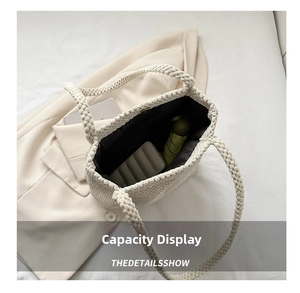 Detail view of woven tote bag interior showing capacity for umbrella and power bank