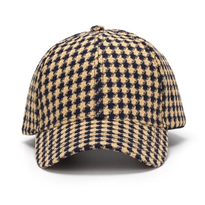 Classic baseball cap with yellow and black houndstooth pattern and curved brim