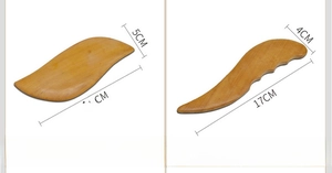 Detail showing leaf and finger blade shaped wooden guasha tools with size measurements