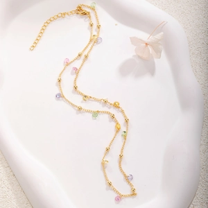 Gold plated bead chain necklace with colorful faceted crystals and lobster clasp closure