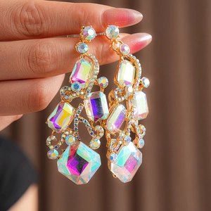 Macro view of vintage gold earrings featuring rainbow crystals and sparkling rhinestones