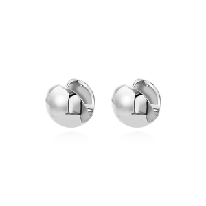 Close-up of polished silver minimalist hollow round earrings with mirror finish effect