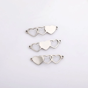 Macro detail of silver plated heart shaped magnetic connectors for DIY jewelry making