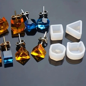 Detail showing geometric silicone earring molds with resin studs in square and cat shapes
