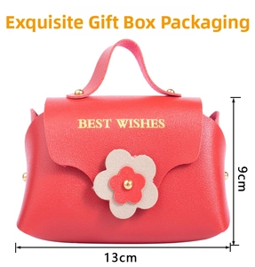 Pink textured leather gift bag with golden BEST WISHES print and floral handle decoration