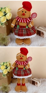 Detailed view of gingerbread chef doll with red hat and candy cane for Christmas decor