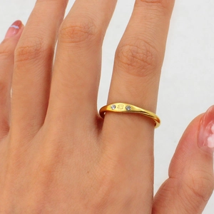 Detail of 18K gold titanium Cancer zodiac ring with sparkling cubic zirconia side stones