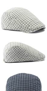 Detail view of vintage grid plaid ivy cap with adjustable metal side buckle and stitching