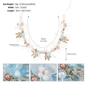 Detail of bridal headband featuring blue silk flowers, white pearls and gold leaves