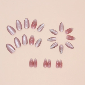 Pink almond press-on nails set featuring cat eye effect and marble flower design