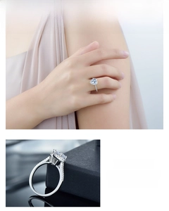 Close-up of heart-shaped zircon ring with S925 sterling silver band and side stones