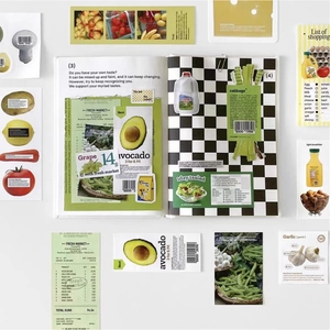 Flat lay of creative supermarket food stickers and grocery list for DIY scrapbooking