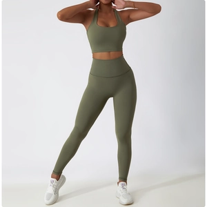 Close-up of olive green high-waisted fitness leggings and halter neck sports bra set