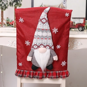 Christmas gnome chair cover with 3D plush doll and red snowflake patterns for holiday decor