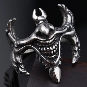 Macro detail of gothic stainless steel demon mask ring with intricate devil carvings
