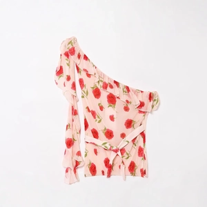 Pink floral off-shoulder sleeveless top with ruffle trim and waist tie detail