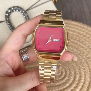 Elegant gold quartz watch with a bold fuchsia dial and weekday date display windows